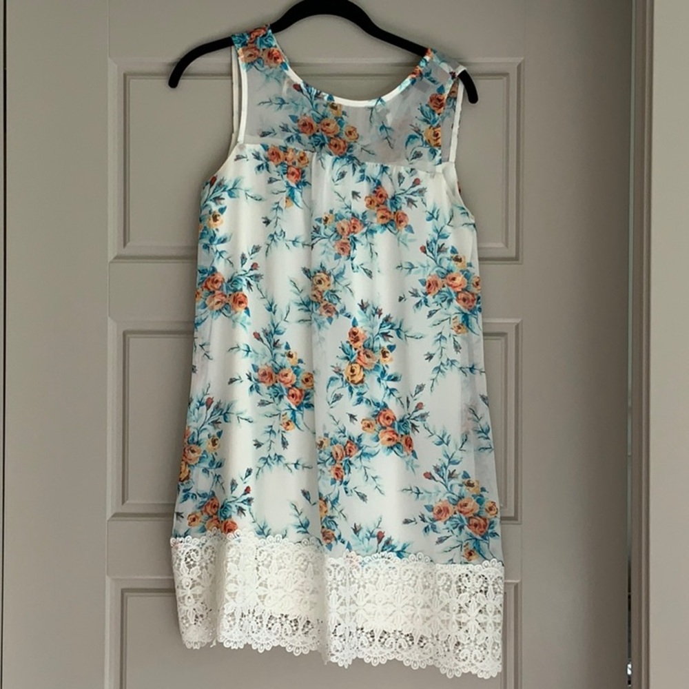 White dress with lace on the bottom.